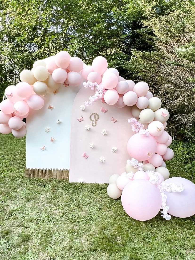 Pink and white outdoor balloon display